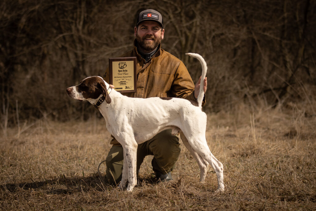 Ben Brettingen with English pointer and first place award.