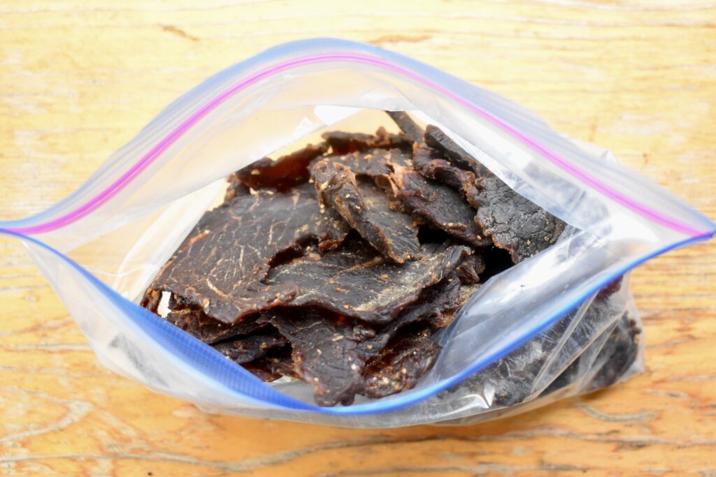 A zip-top bag with a pound of jerky.