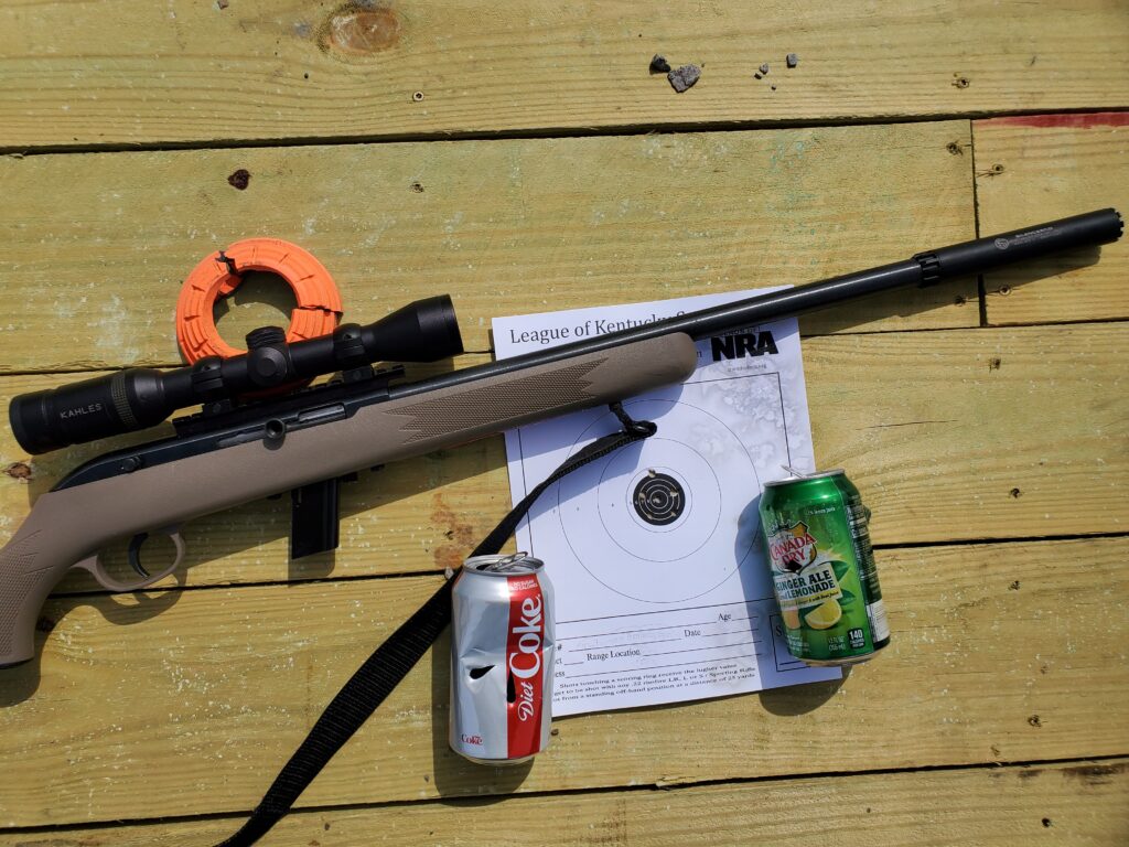 Target shooting with a suppressed .22 rifle.