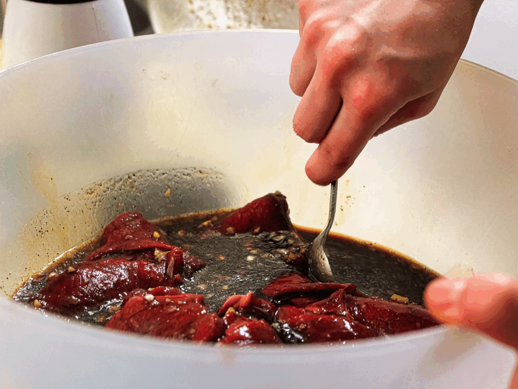 Mixing a marinade for homemade jerky.
