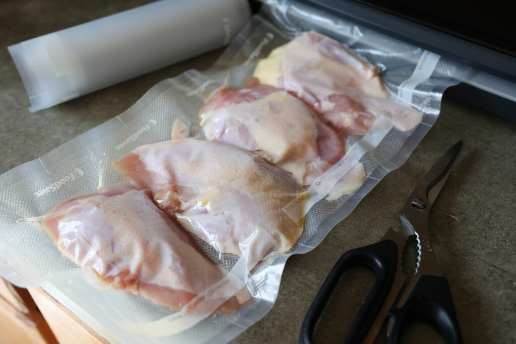 Using a vacuum sealer to store wild pheasant meat in the freezer.