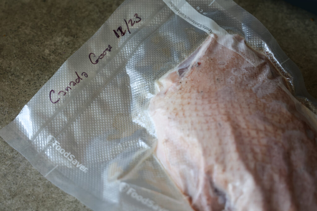 A Canada goose breast meat in a vacuum sealed bag.