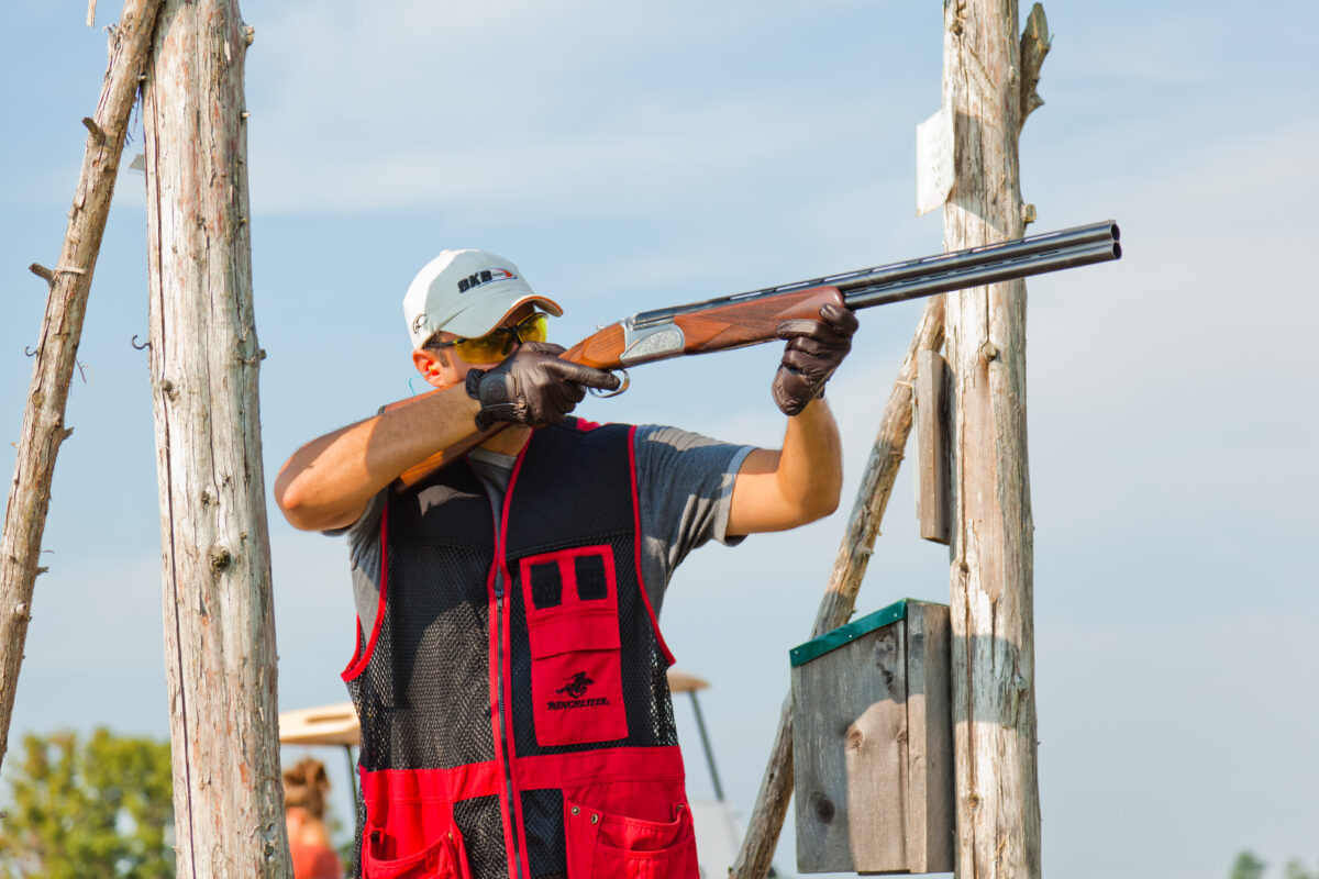 a sporting clays shooter with a shotgun